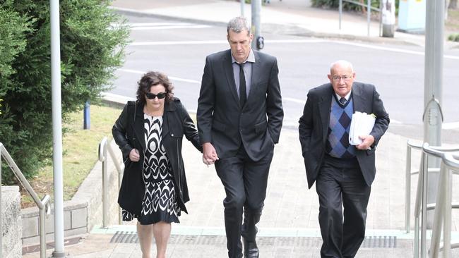 Julie Goodwin arrives at Gosford Court with her husband Mick Goodwin (centre). Pic: AAP Image/Mark Scott