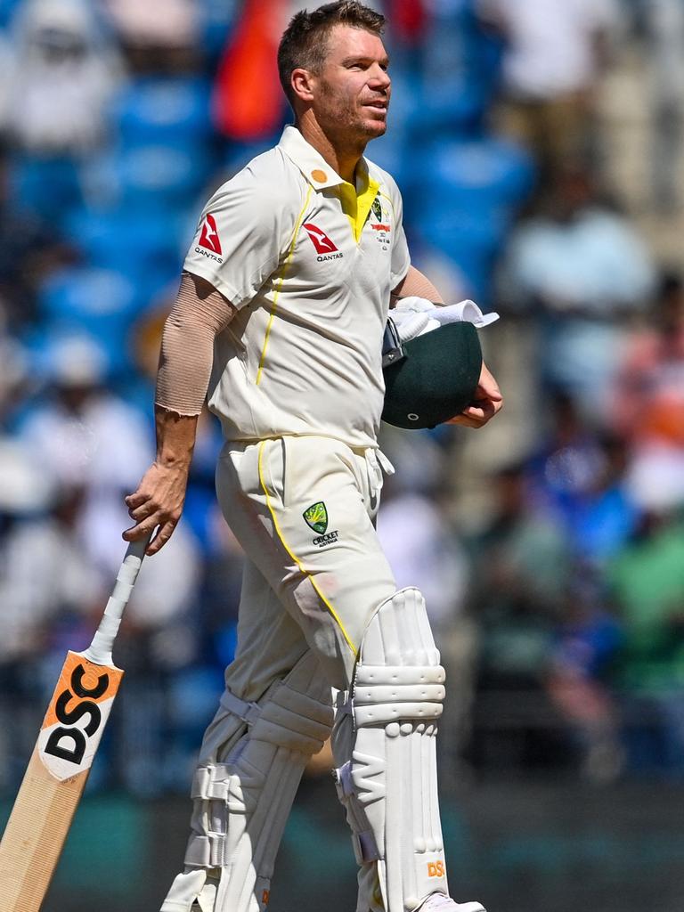 David Warner heads off after being dismissed.