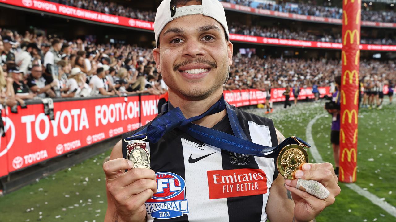 Bobby Hill of the Magpies with his Norm Smith Medal for best on ground and his premiership medal. Picture: Michael Klein
