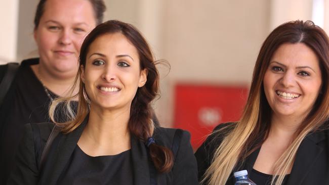 Rachelle Louise ( centre with coffee cup ) with supporters which include Simon Gittanys sisters outside the JMT courts after being cross examined in her defamation trial .pic John Grainger