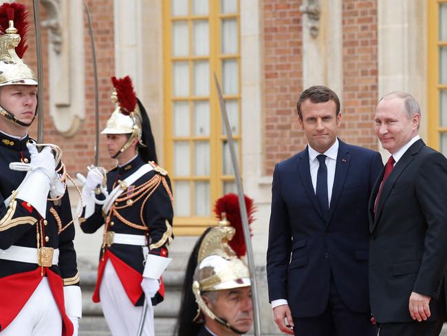 Emmanuel Macron welcomes Vladimir Putin at the Versailles Palace in 2017. Picture: AFP