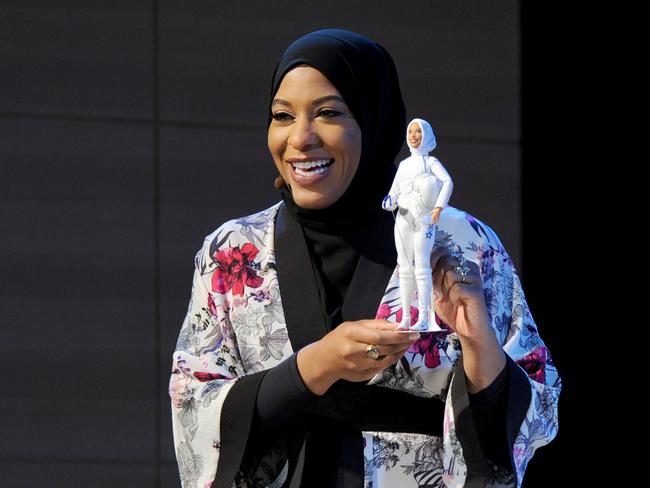 US Olympic Medalist Ibtihaj Muhammad with the Barbie doll in her image. Picture: Getty