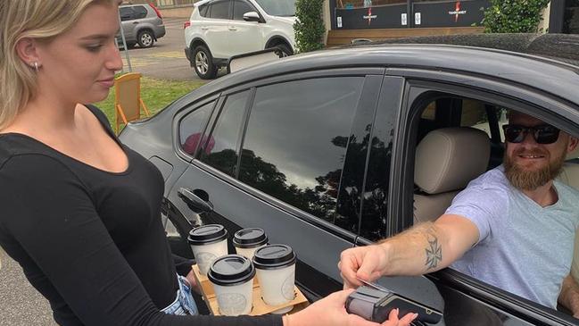 The first customer through Fahrenheit Cafe's makeshift drive-through bay at East Gosford. Picture: supplied