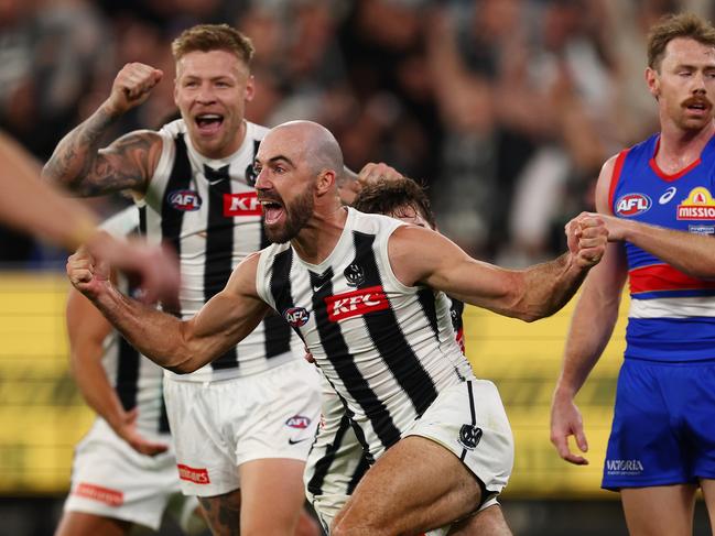 Steele Sidebottom wheels off to celebrate his matchwinner. Picture: Morgan Hancock/AFL Photos/Getty Images