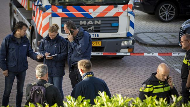 Policemen at the site of a shooting in the Amsterdam district of Buitenveldert where Dutch lawyer Derk Wiersum was shot dead. Picture: Michel van Bergen/ANP/AFP/Netherlands OUT