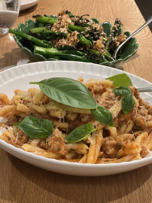 A pasta dish and a side of broccolini at Roma. Picture: Supplied