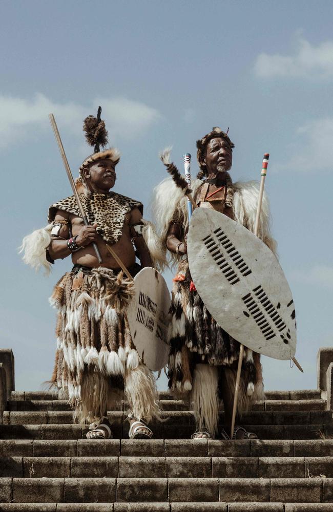 Amabutho (Zulu Regiments) pose with their shields and sticks ahead of Prince Mangosuthu Buthelezi’s funeral proceedings in Ulundi, South Africa. The Zulu prince and veteran politician was commemorated with a state funeral, despite being a controversial figure during the apartheid liberation due to his rivalry with the African National Congress. Picture: Marco Longari/AFP 