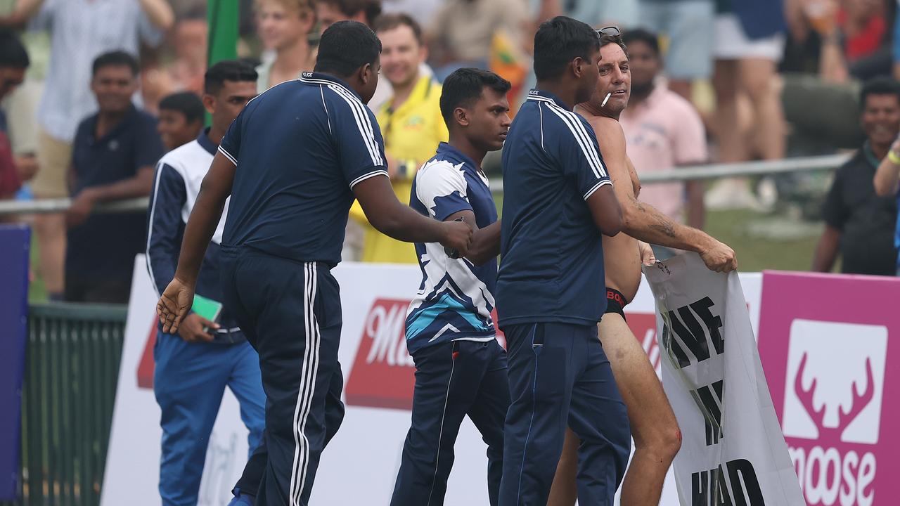 A pitch invader is taken from the ground during day one of the First Test (Photo by Robert Cianflone/Getty Images)