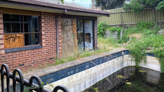 The pool and backyard of an abandoned house at Buchanan Grove, Reynella East. Picture: Nat Cook MP