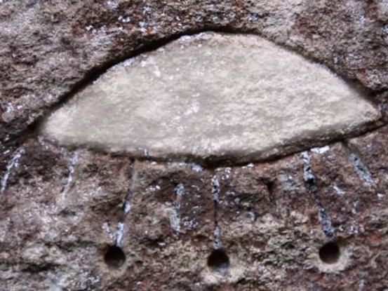 Aliens! Really? This shape scratched out of the sandstone face of a Gosford rock formation is being interpreted as representing an ancient flying saucer. Picture: History Channel