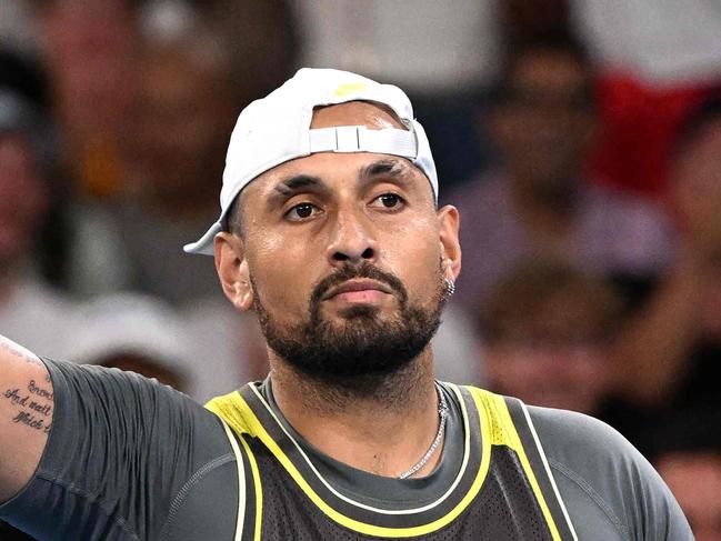 Australia's Nick Kyrgios reacts after winning a game against Britain's Jacob Fearnley during their men's singles match on day two of the Australian Open tennis tournament in Melbourne on January 13, 2025. (Photo by WILLIAM WEST / AFP) / -- IMAGE RESTRICTED TO EDITORIAL USE - STRICTLY NO COMMERCIAL USE --