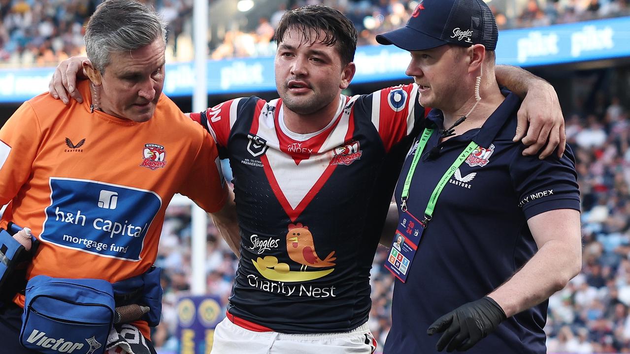 SYDNEY, AUSTRALIA - SEPTEMBER 01: Brandon Smith of the Roosters is helped off the field with an injury during the round 26 NRL match between Sydney Roosters and Canberra Raiders at Allianz Stadium, on September 01, 2024, in Sydney, Australia. (Photo by Cameron Spencer/Getty Images)