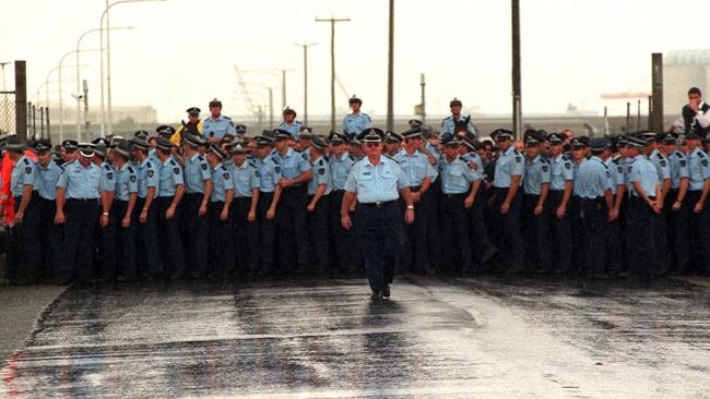 Hundreds of police prepare for a confrontation with MUA picketers at Port of Brisbane.