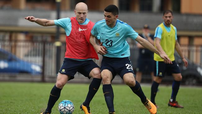 Socceroos midfielders Aaron Mooy (left) and Tom Rogic at training in Malaysia ahead of the World Cup playoff against Syria.