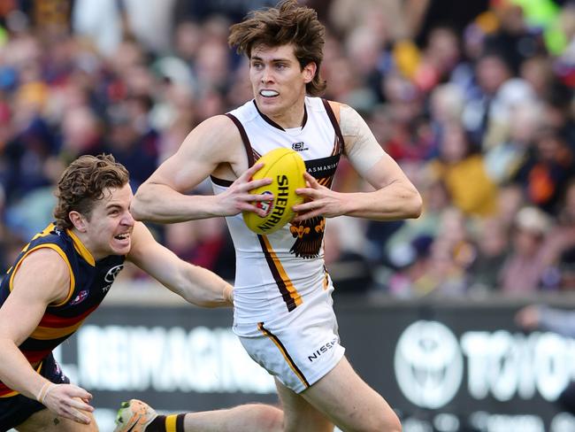 Will Day of the Hawks with the ball against Adelaide. Picture: Sarah Reed/AFL Photos via Getty Images.