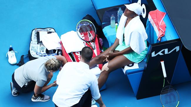 Venus Williams receives treatment on her ankle during her second-round loss.