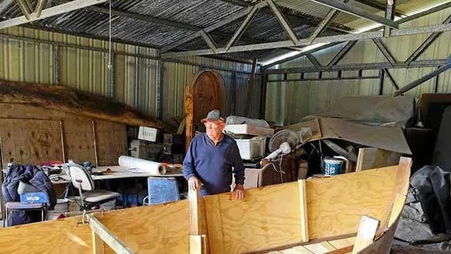 Errol Lindsay builds a new boat after his previous boat was set alight while moored at Lake Coootharaba in June.