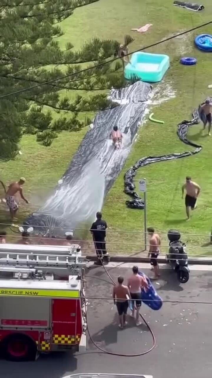 Firefighters lend a hand with slip 'n slide fun