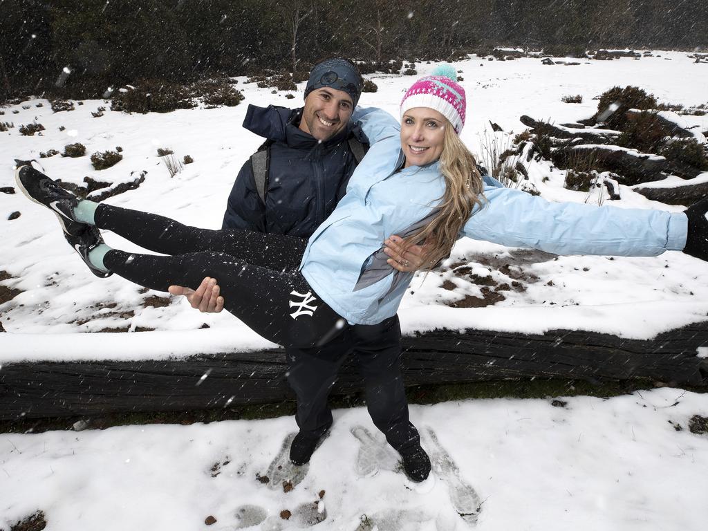 Chris and Michelle Parker of Brisbane enjoy the snow at Cradle Mountain. PICTURE CHRIS KIDD