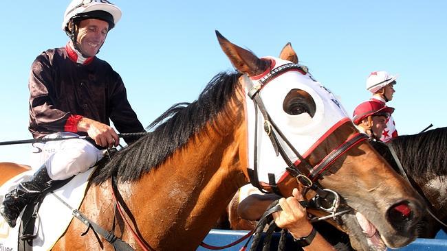 Damien Oliver celebrates his Perth Cup win aboard Black Tycoon. Picture: Warchomij Bohdan 