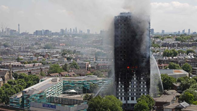 Smoke and flames billows from Grenfell Tower as firefighters attempt to control a blaze at a residential block of flats on June 14, 2017 in west London. Picture: AFP PHOTO / Adrian DENNIS