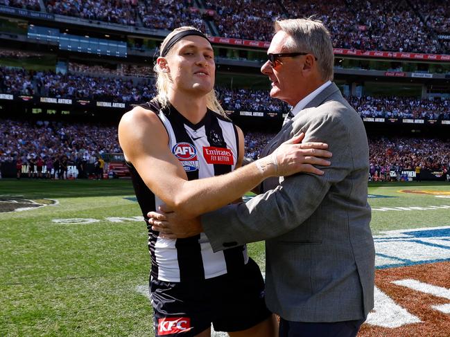 Darcy and Peter Moore embrace before the Grand Final. Picture: Dylan Burns/AFL Photos via Getty Images