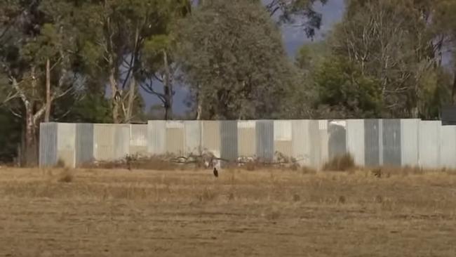 The compound was concealed behind this fence. Picture: 7NEWS.