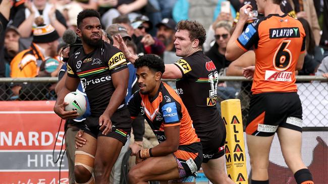 Sunia Turuva of the Panthers celebrates with teammates after scoring a try. (Photo by Cameron Spencer/Getty Images)