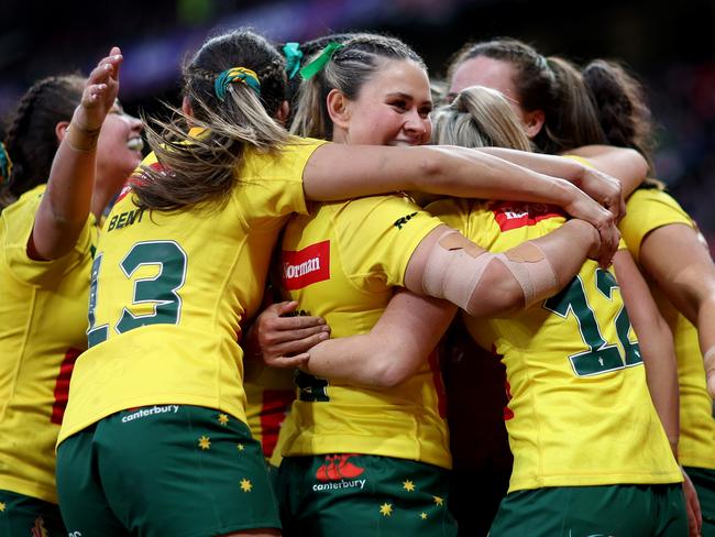 MANCHESTER, ENGLAND - NOVEMBER 19: Evania Pelite of Australia celebrates their sides tenth try with teammates during the Women's Rugby League World Cup Final match between Australia and New Zealand at Old Trafford on November 19, 2022 in Manchester, England. (Photo by Naomi Baker/Getty Images)