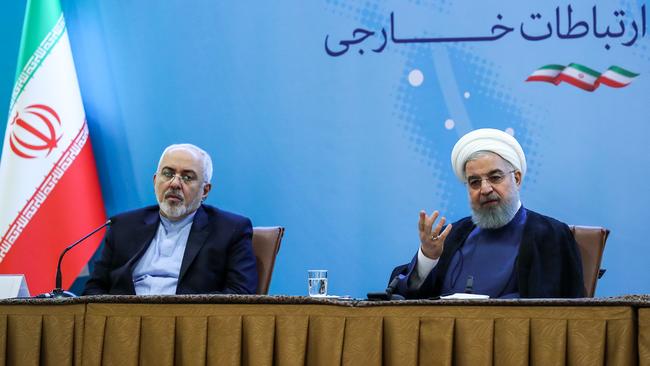 Hasan Rowhani, right, speaks to Iranian diplomats with Foreign Minister Mohammad Javad Zarif in Tehran yesterday. Picture: AFP