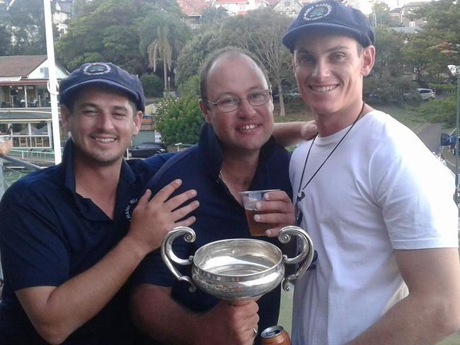 Michael 'Juice' Shepheard (centre) celebrating another trophy win with the players at Manly Oval. Picture: Facebook (Michael Shepheard)