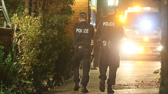 Police at a Punchbowl address raided by counter-terrorism police. Picture: Steve Tyson