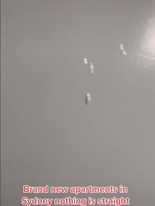 Drops of dried paint are visible on the door of a ‘finished’ new apartment. Picture: TikTok