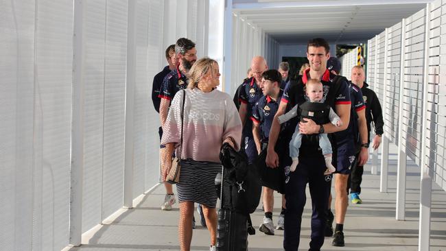 AFL players from Richmond and the Western Bulldogs arrive at the Gold Coast Airport with their families before heading to their hotels. Picture Glenn Hampson