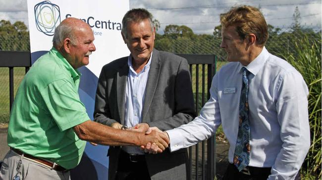 END OF AN ERA: Horton Park Golf Club president Geoff Davies symbolically hands over the course keys and gives his best to SunCentral Maroochydore Pty Ltd chief executive John Knaggs and acting Mayor Chris Thompson. Picture: Pete Evans