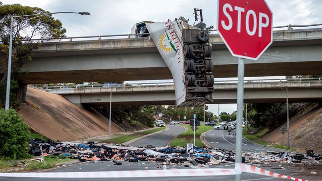 No one was injured after a truck was left hanging over a Victorian overpass. Picture: Jake Nowakowski