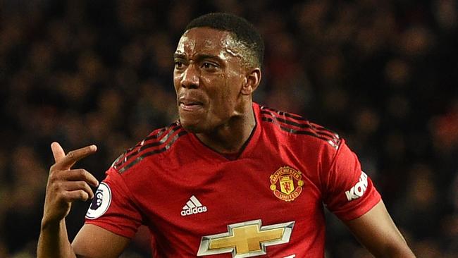 Manchester United's French striker Anthony Martial (2R) celebrates after scoring the team's second goal during the English Premier League football match between Manchester United and Newcastle at Old Trafford in Manchester, north west England, on October 6, 2018. (Photo by Oli SCARFF / AFP) / RESTRICTED TO EDITORIAL USE. No use with unauthorized audio, video, data, fixture lists, club/league logos or 'live' services. Online in-match use limited to 120 images. An additional 40 images may be used in extra time. No video emulation. Social media in-match use limited to 120 images. An additional 40 images may be used in extra time. No use in betting publications, games or single club/league/player publications. /