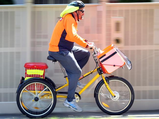 Australia Post is trialling electric tricycles for mail delivery. Postie Brendan Peel delivering with the new tricycle around Preston.