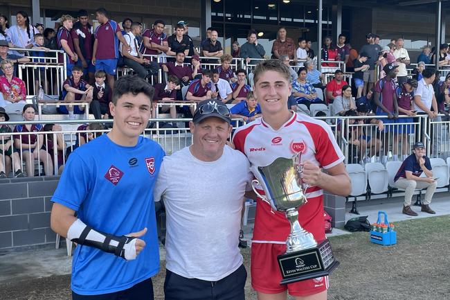 Palm Beach Currumbin players Marley McLaren and Taj lateo with Broncos legend Kevin Walters after the school won the 2023 Walters Cup.
