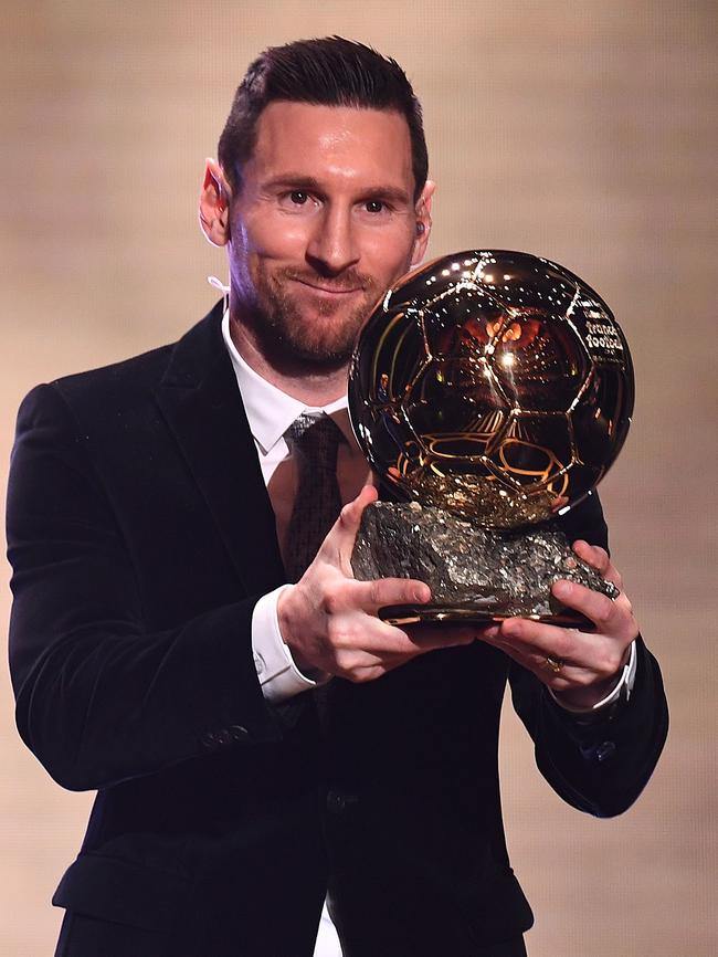 Lionel Messi with the Ballon d’Or