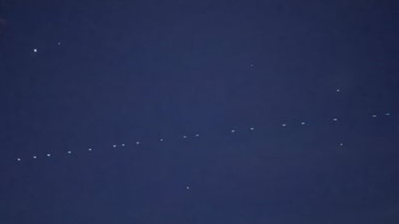 Mysterious string of lights hovering above Australian sky linked to an