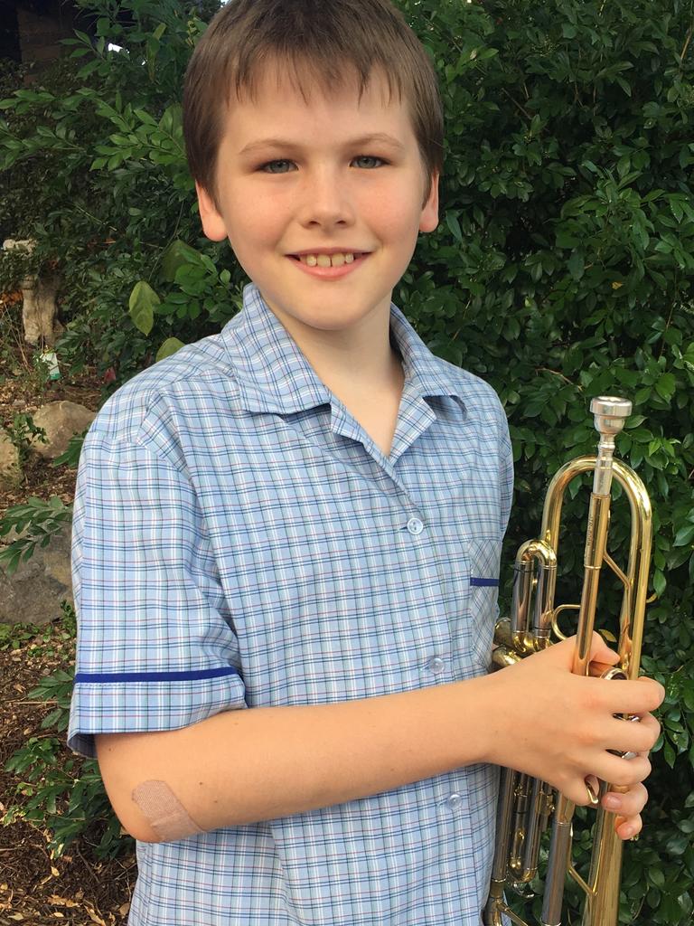 Anzac driveway musician Cooper, from Year 6 at Middle Park State School.