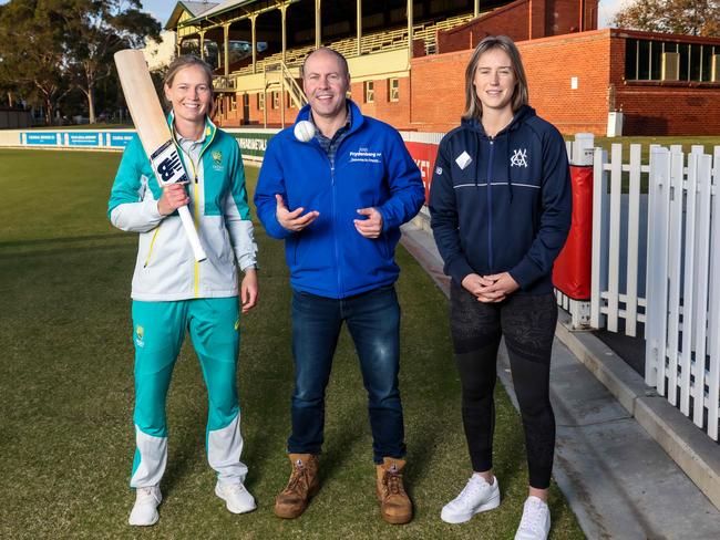 Federal Treasurer Josh Frydenberg with Australian cricketers Meg Lanning and Ellyse Perry at the Junction Oval. Picture: Ian Currie