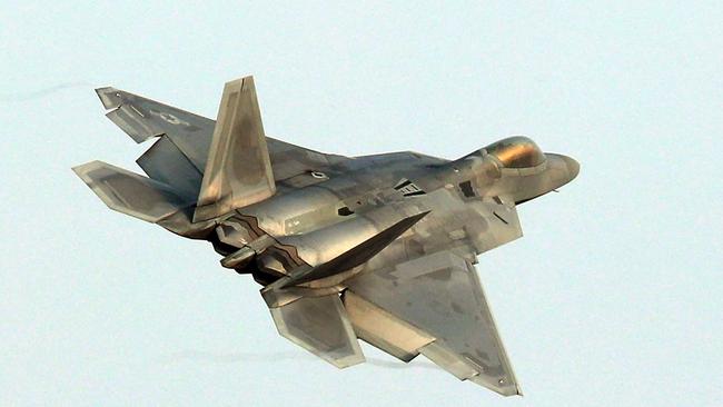 A US Air Force F-22 Raptor stealth jet flies over a South Korean air base in Gwangju on December 4, 2017. The US and South Korea on December 4 kicked off their largest ever joint air exercise, an operation North Korea has labelled an "all-out provocation", days after Pyongyang fired its most powerful intercontinental ballistic missile. / AFP PHOTO / YONHAP / - /  - South Korea OUT / NO ARCHIVES -  RESTRICTED TO SUBSCRIPTION USE