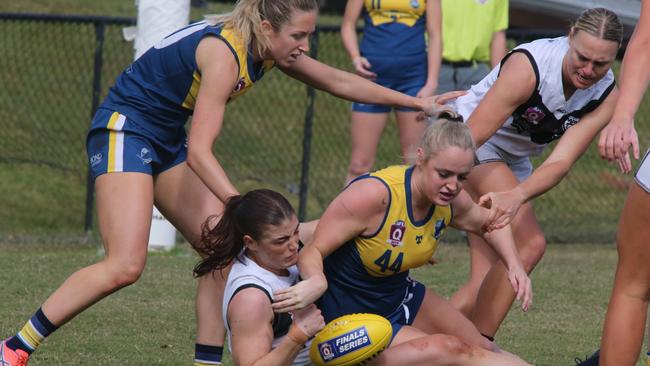 Bond University Bull Sharks player Teagan Tatlock is tackled by Southport Player Rianna Schipp. Photo: Mike Batterham.