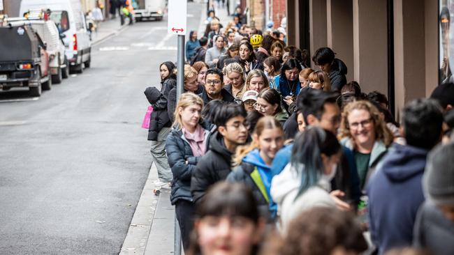 Dozens of people queued in Melbourne for tickets. Picture: Jake Nowakowski