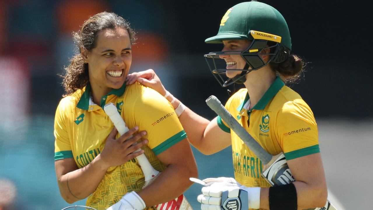 Chloe Tryon and Laura Wolvaardt of South Africa celebrate victory in Canberra. (Photo by Mark Metcalfe/Getty Images)