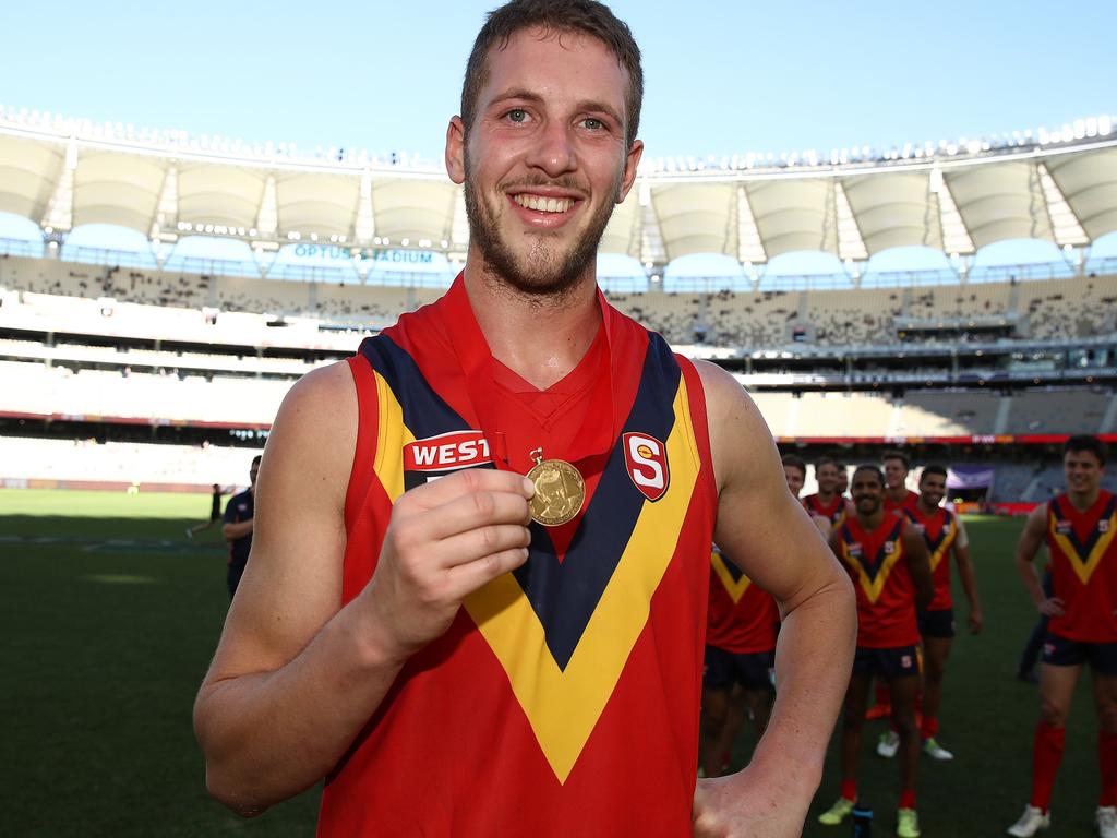 PERTH, AUSTRALIA - MAY 12: Michael Knoll of the SANFL poses with the Foss-Williams medal for best SANFL player during the state game between WA and SA at Optus Stadium on May 12, 2019 in Perth, Australia. (Photo by Paul Kane/Getty Images)