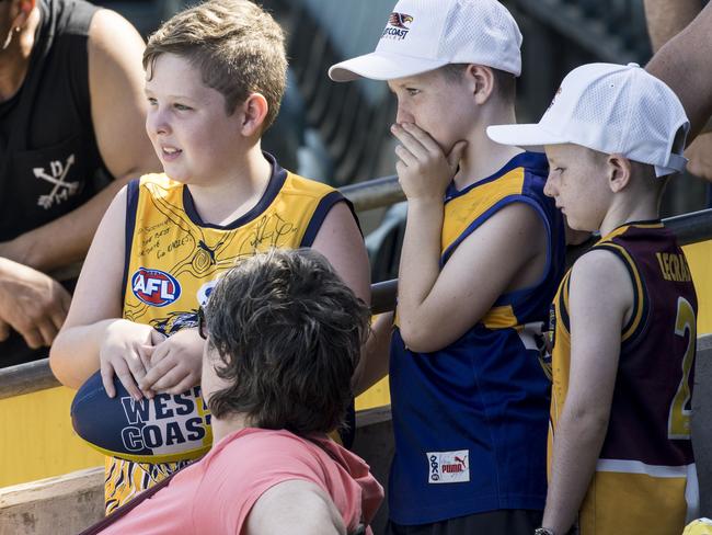 West Coast Eagles players during an open training session at Subiaco Oval on Wednesday. Pictured are young fans watching the training session. Picture: Matthew Poon