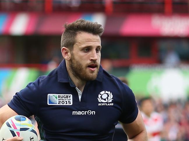 GLOUCESTER, ENGLAND - SEPTEMBER 23: Tommy Seymour of Scotland goes over to score his teams third try during the 2015 Rugby World Cup Pool B match between Scotland and Japan at Kingsholm Stadium on September 23, 2015 in Gloucester, United Kingdom. (Photo by Ben Hoskins/Getty Images)